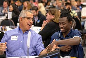 Students have a conversation at an event